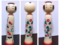 Kakizawa Yoshinobu (柿沢是伸)  This Kokeshi is one of his new reverse styles where there are 2 unique designs front and back and you can turn the Kokeshi's head to make either one the front.
