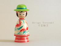 Hiraga Teruyuki 22  (平賀輝幸)  Adorable little Kokeshi with a Flamboyant Green Hat Crab Flower Mum Pattern