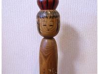 Tokunaga, Shinichi (徳永慎一)  This Kokeshi strikes me more of a Shingata style than Tsuchiyu.