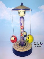 Kakizawa Yoshinobu (柿沢是伸) Merry Go-round featuring little Kokeshi Princess in red, yellow and purple