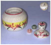 Matsuda Tomohiro (松田大弘) Ejiko Kokeshi, size of a half dollar with miniature spinning tops inside.