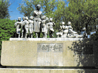 Shodo Shima Island Monument depicting a teacher with her 12 students.