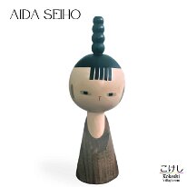 Aida Seihō (相田 晴峰) This is a factory produced Kokeshi by Aida it is called Tomboy. I was informed that their are several chopmarks and signatures which identify if the Kokeshi was...