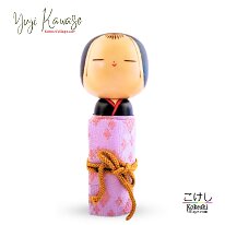 Yuji Kawase (川瀬祐志作) A beautifully crafted sayonara doll. The pink silk fabric covered roll of paper is wrapped securely around the body of this Kokeshi and then tied with a golden...